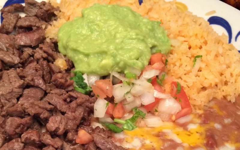 Carne asada with rice, beans, guacamole and pico de gallo